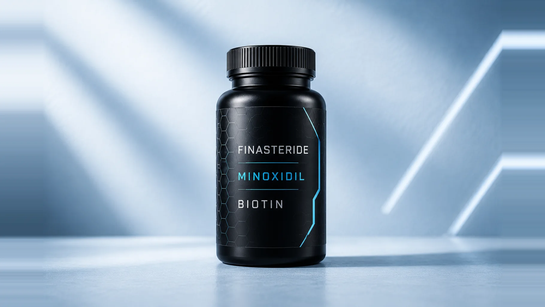 A matte black pill bottle labelled Finasteride, Minoxidil, Biotin, lit by cool studio strip lights against a pale blue background